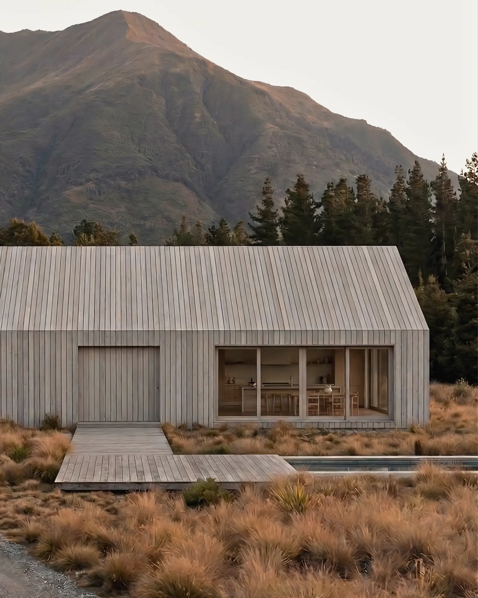 Gabled timber-clad residential home in a New Zealand landscape